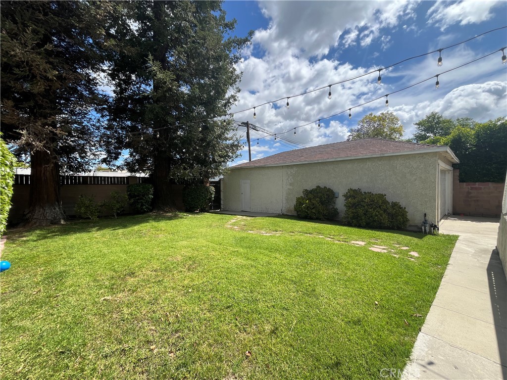 18029 Santa Rita Street Encino, CA 91316 - Photo 19 of 20 a backyard of a house with lots of green space
