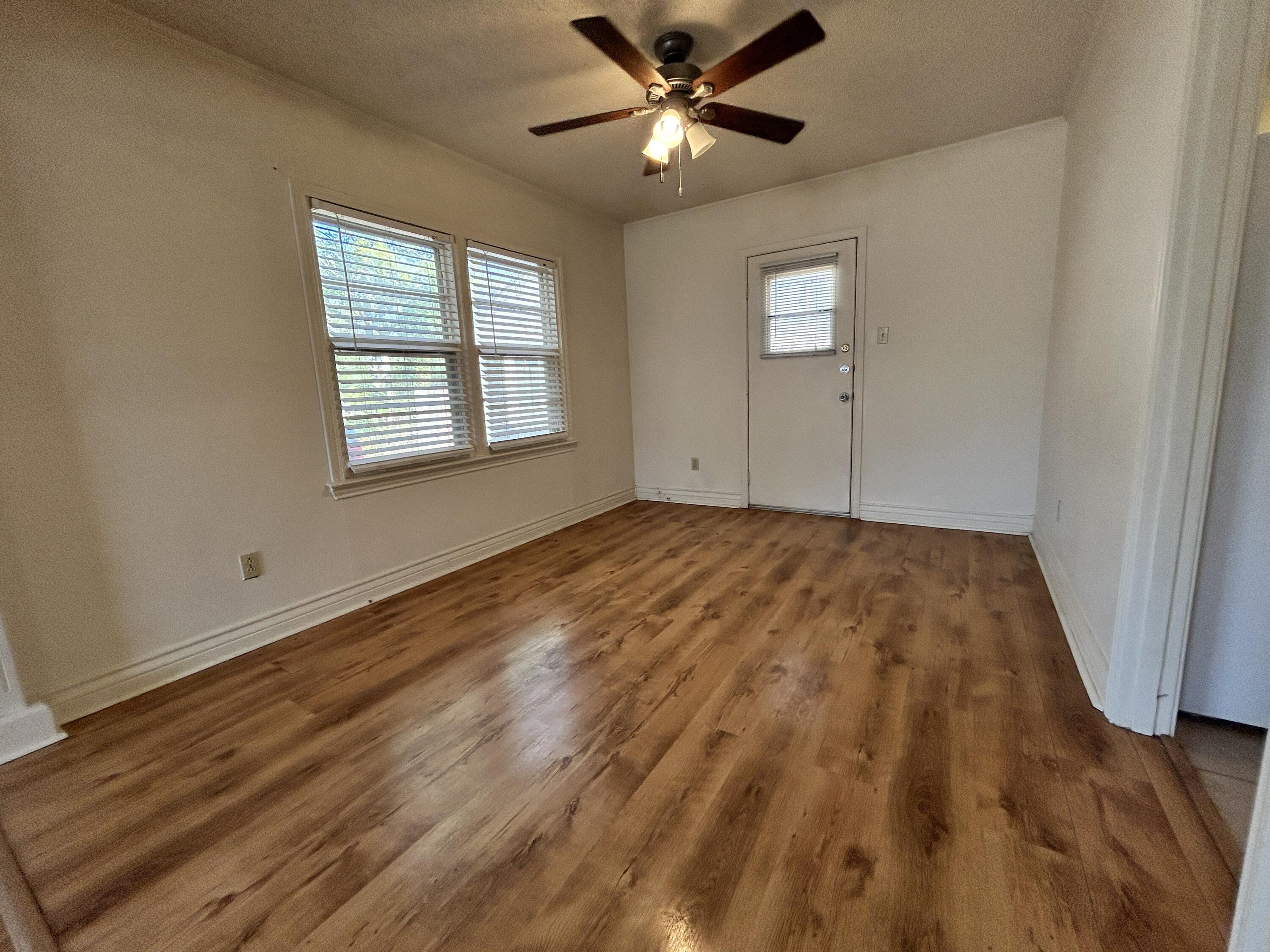 2216 30th Street, Unit FRONT Lubbock, TX 79411 - Photo 9 of 11 a view of an empty room and window