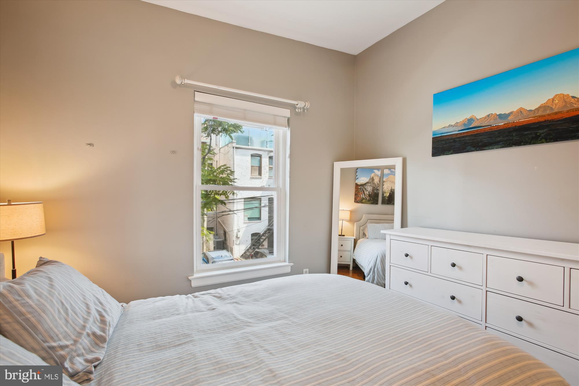 1725 Willard Street Northwest, Unit 3 Washington, DC 20009 - Photo 15 of 32 a bedroom with a bed and a window