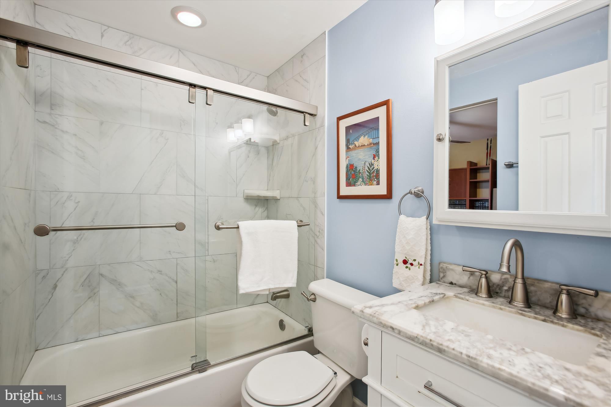 1725 Willard Street Northwest, Unit 3 Washington, DC 20009 - Photo 17 of 32 a bathroom with a granite countertop sink toilet and shower
