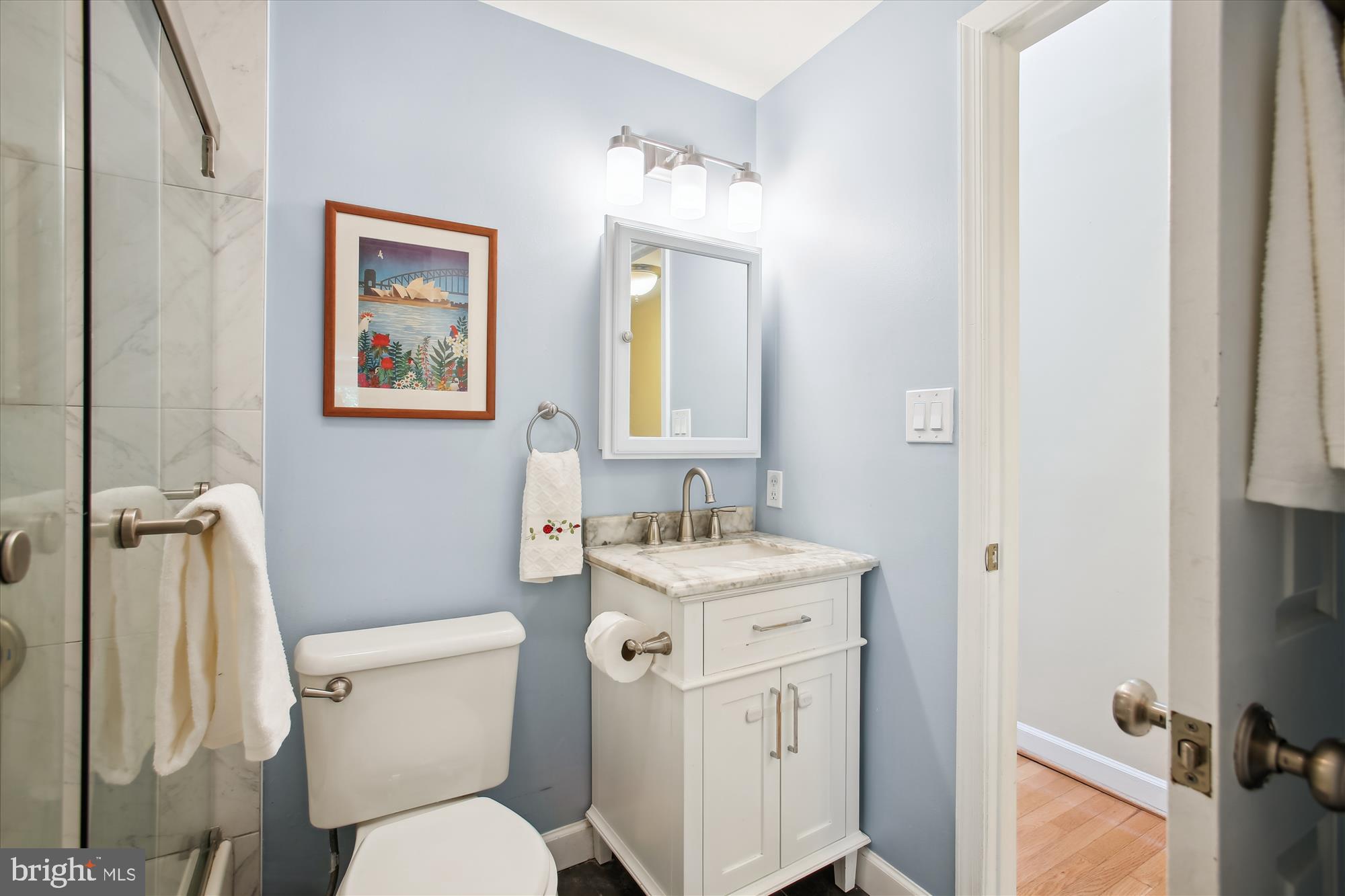 1725 Willard Street Northwest, Unit 3 Washington, DC 20009 - Photo 18 of 32 a bathroom with a toilet sink and mirror