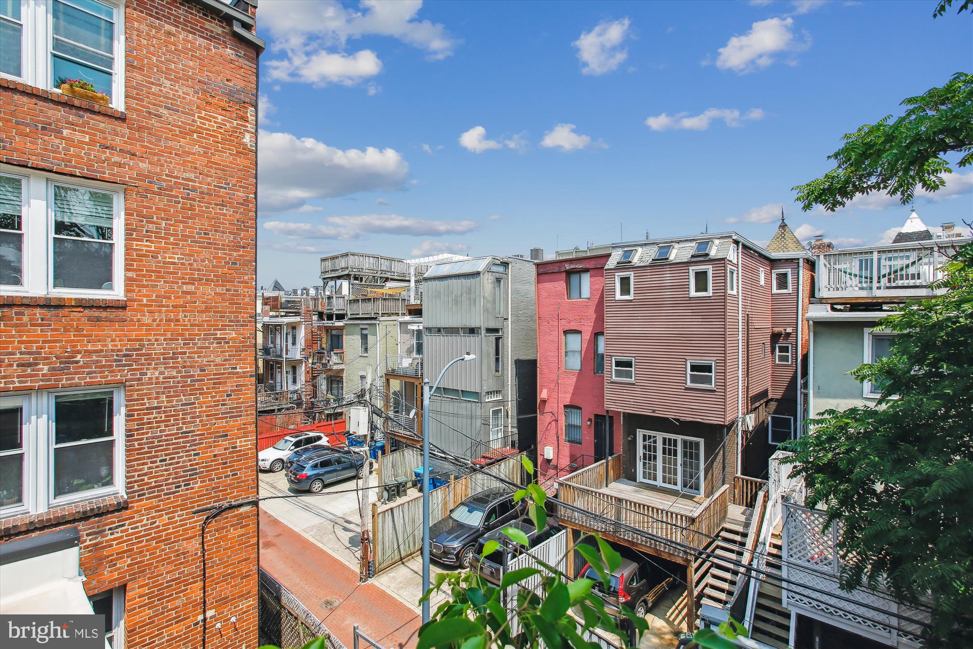 1725 Willard Street Northwest, Unit 3 Washington, DC 20009 - Photo 28 of 32 a view of multiple houses with outdoor seating