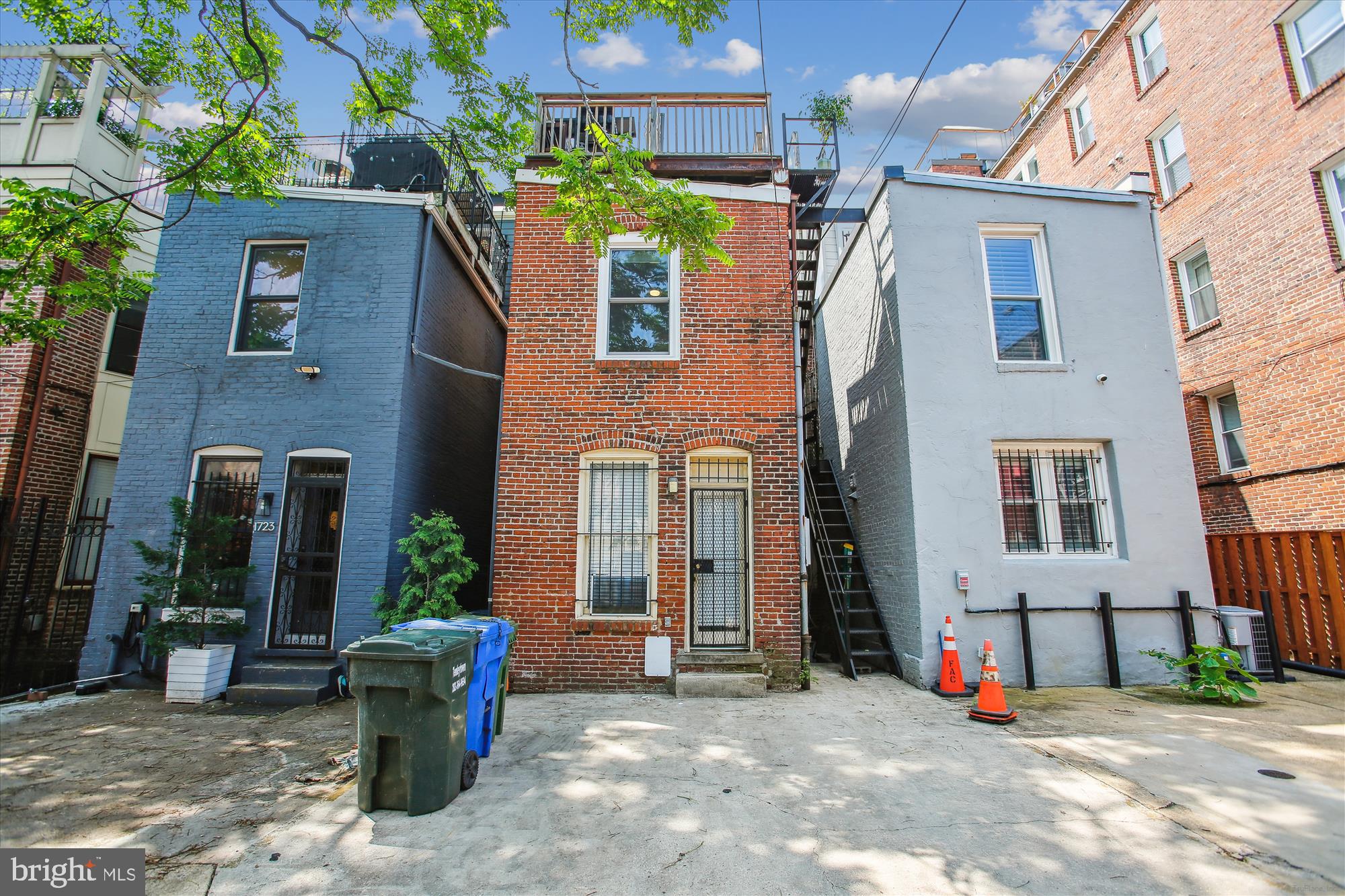 1725 Willard Street Northwest, Unit 3 Washington, DC 20009 - Photo 31 of 32 a view of a house with many windows next to a building