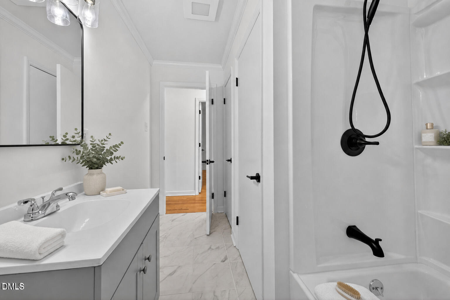302 Normandy Street Durham, NC 27707 - Photo 17 of 29 a bathroom with a sink and a mirror