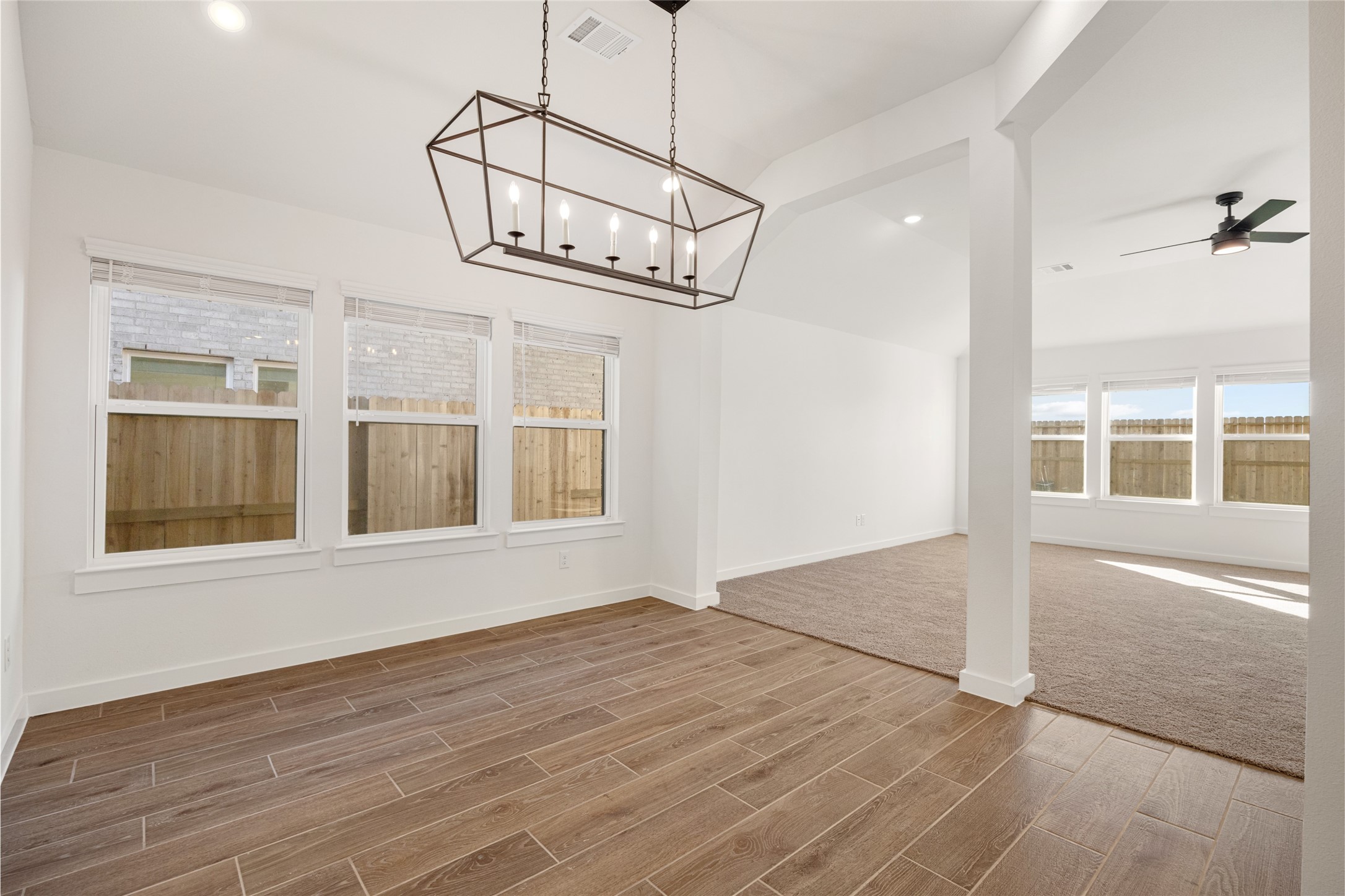 3222 Emerald Hills Drive Angleton, TX 77515 - Photo 18 of 31 a view of an empty room with a window and wooden floor