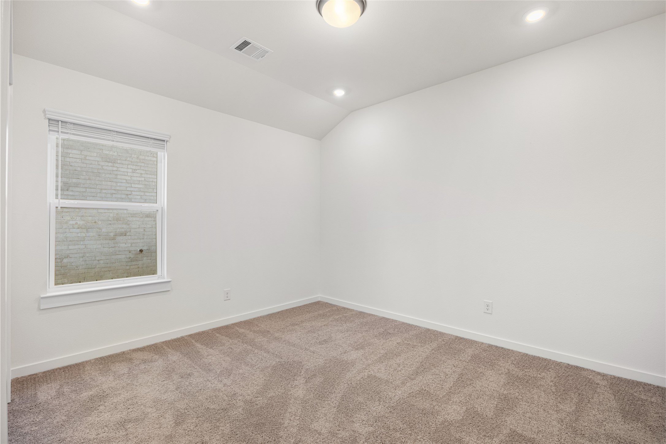 3222 Emerald Hills Drive Angleton, TX 77515 - Photo 21 of 31 an empty room with a window