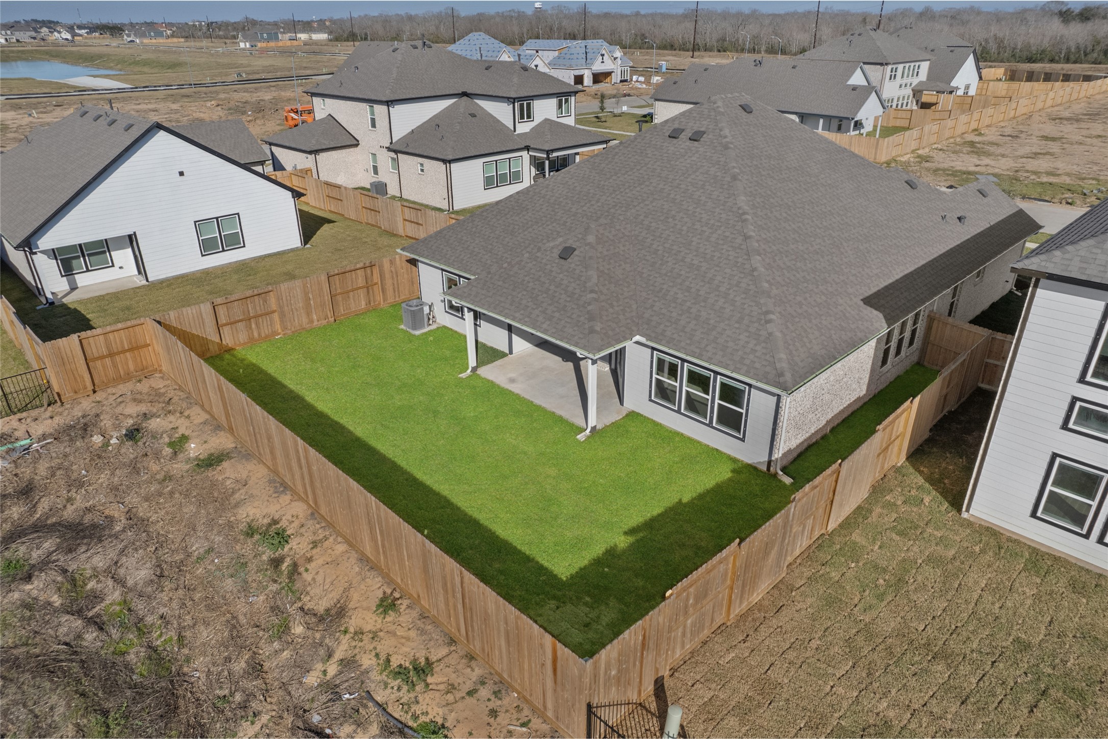 3222 Emerald Hills Drive Angleton, TX 77515 - Photo 29 of 31 an aerial view of a house with a backyard