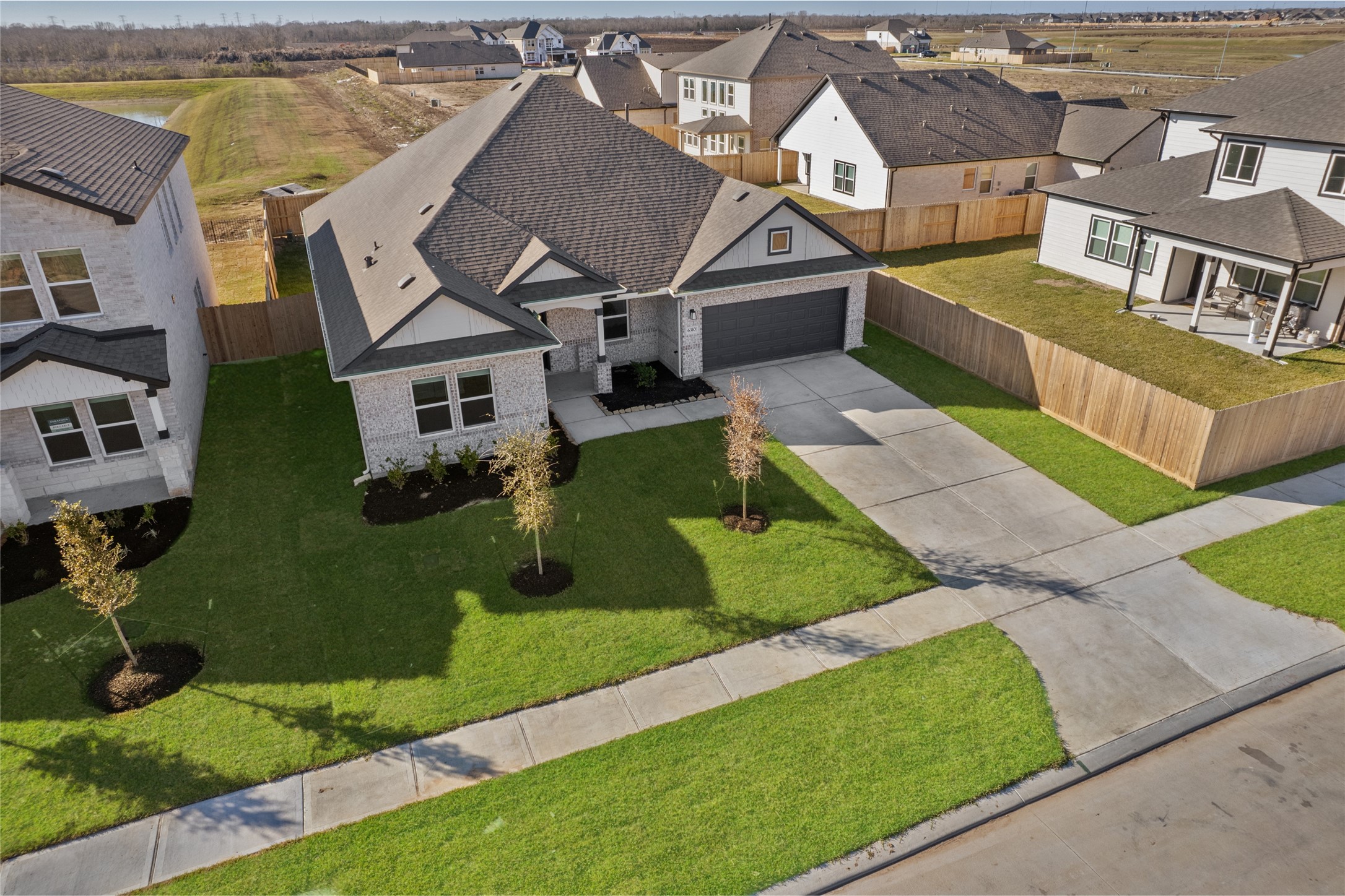 3222 Emerald Hills Drive Angleton, TX 77515 - Photo 6 of 31 an aerial view of a house with a yard