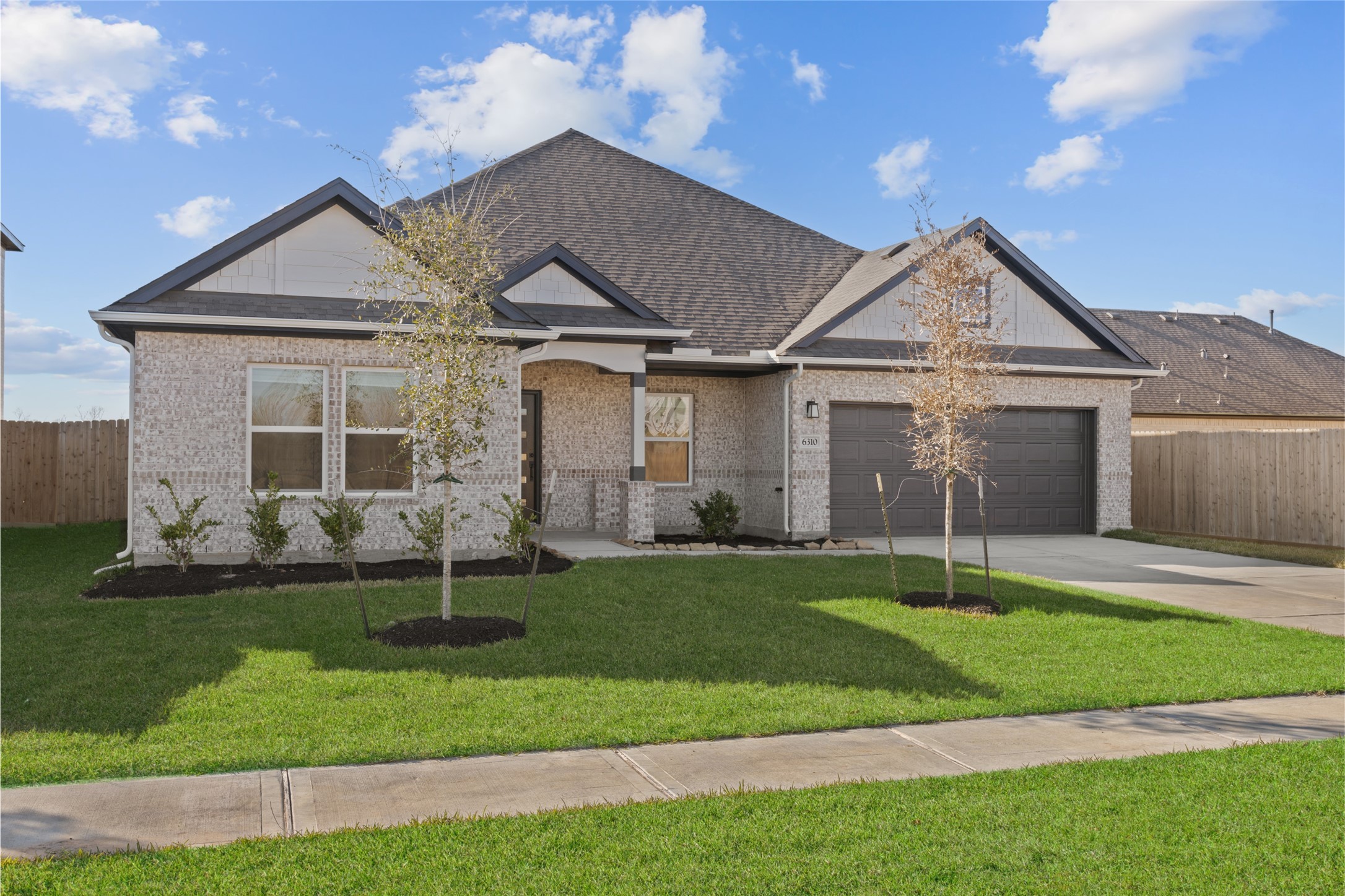 3222 Emerald Hills Drive Angleton, TX 77515 - Photo 7 of 31 a front view of a house with a yard