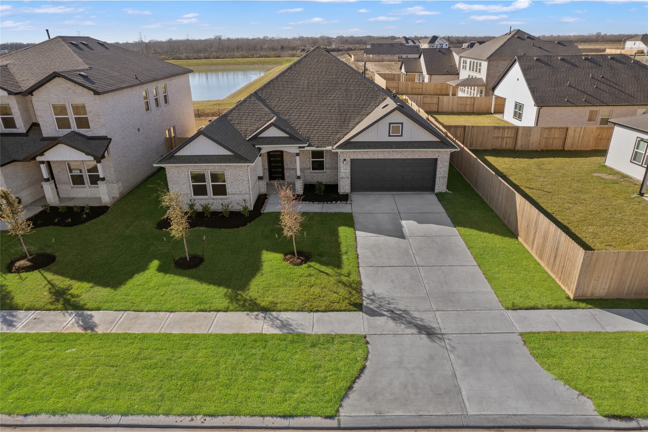 3222 Emerald Hills Drive Angleton, TX 77515 - Photo 8 of 31 an aerial view of a house with a yard