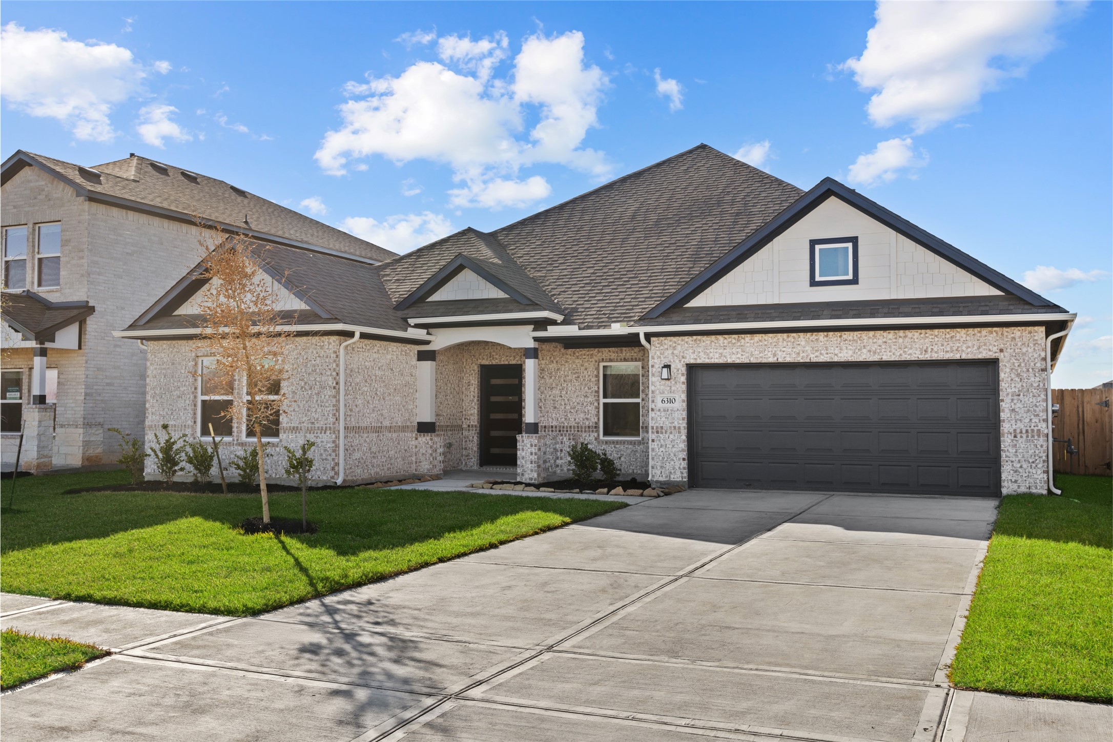 3222 Emerald Hills Drive Angleton, TX 77515 - Photo 9 of 31 a front view of a house with a yard and garage