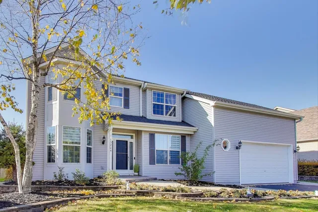 front view of a building with a garden