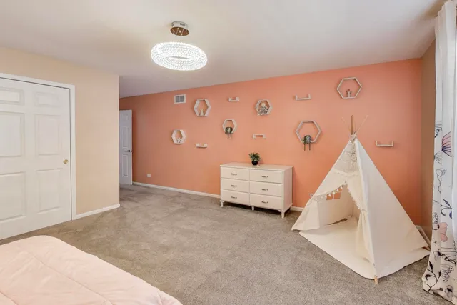 wooden floor with white walls and window