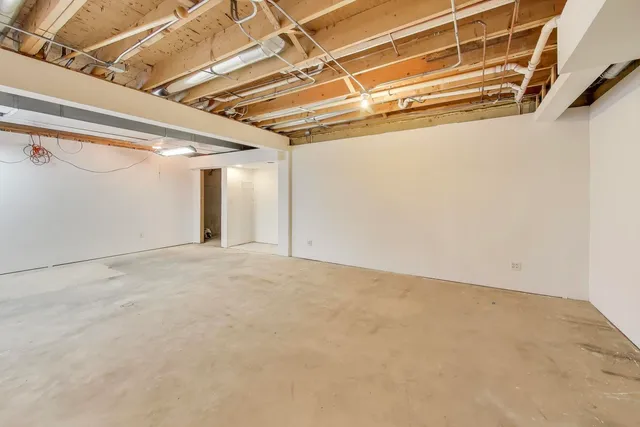 a view of a room with wooden walls