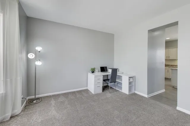 a view of room with furniture and air conditioner vent