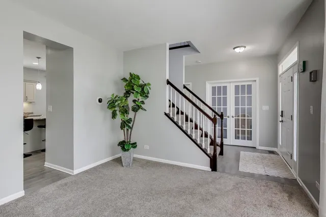 a view of an entryway with a hallway
