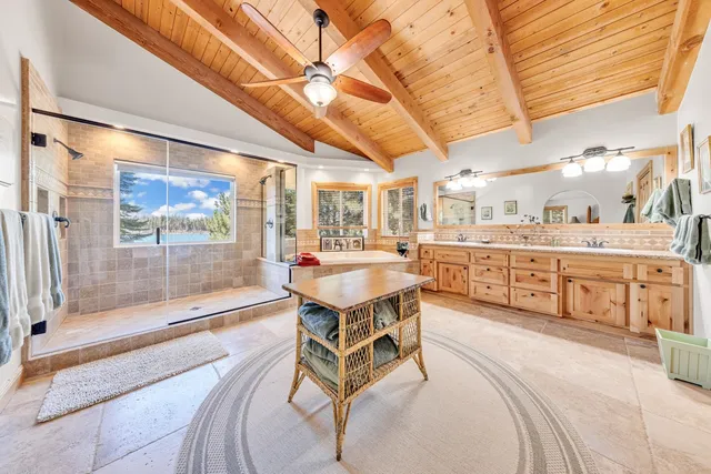 a room with gym equipment and large windows