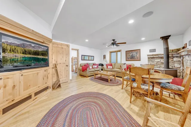 a living room with lots of furniture and a flat screen tv
