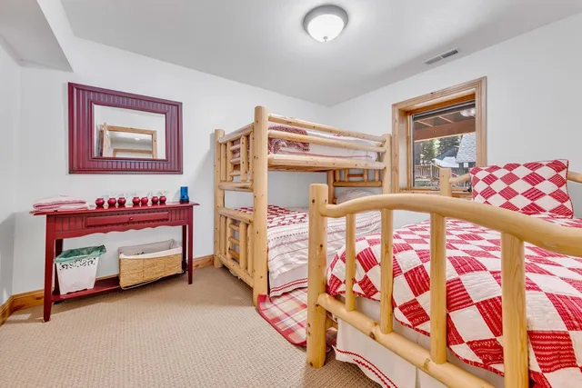 a bedroom with furniture and a window