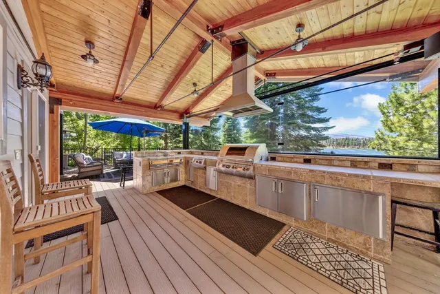 a view of a backyard with sitting area