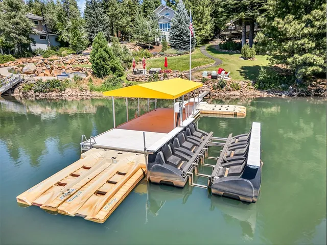 a view of a lake with a table and chairs