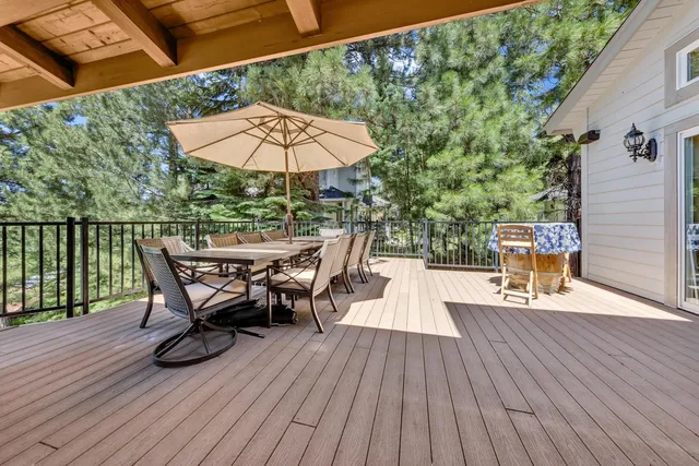 an outdoor space with furniture and umbrella