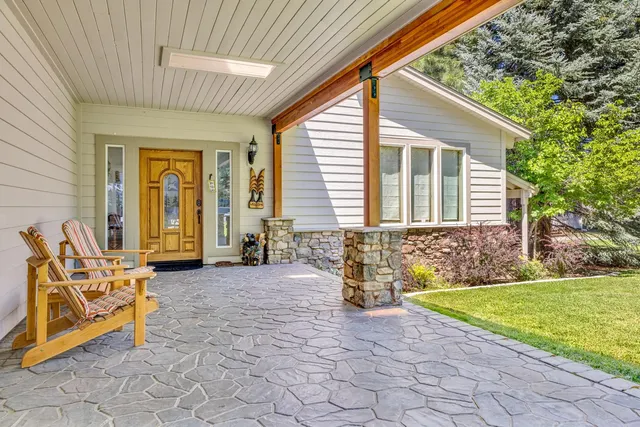 a front view of house with yard patio and fire pit
