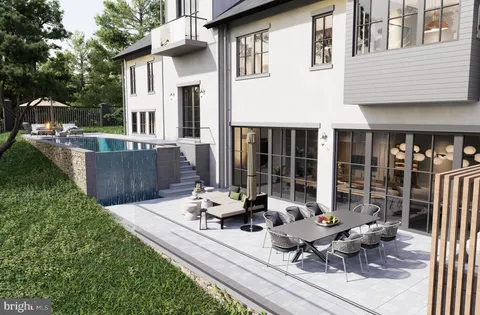 a view of a house with sitting area and garden