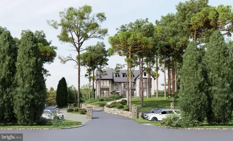 a view of a building with a yard and fountain