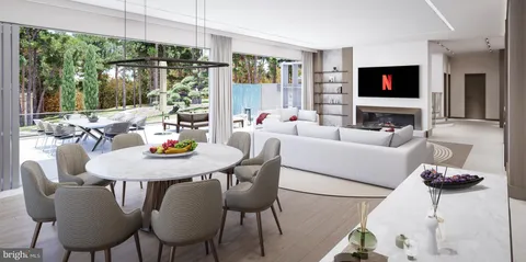a living room with furniture a flat screen tv and a floor to ceiling window