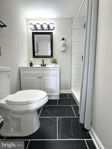 a bathroom with a toilet and a sink