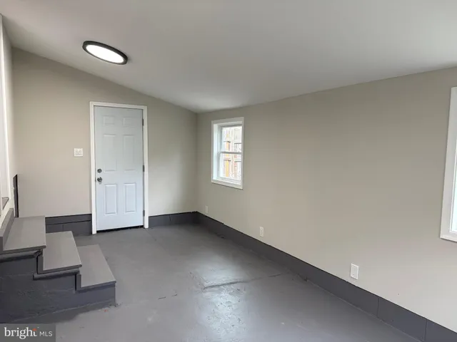 an empty room with windows