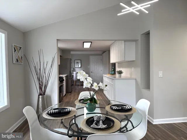 a table with chairs and stove