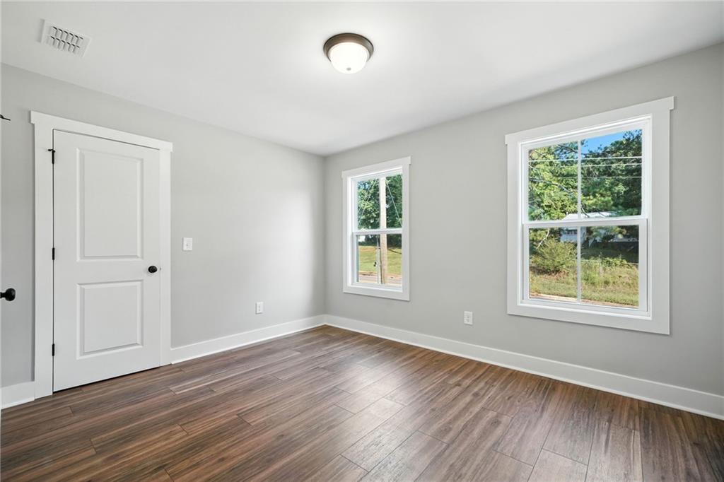 125 Old Alabama Road Southeast Emerson, GA 30137 - Photo 27 of 37 a view of an empty room with wooden floor and a window