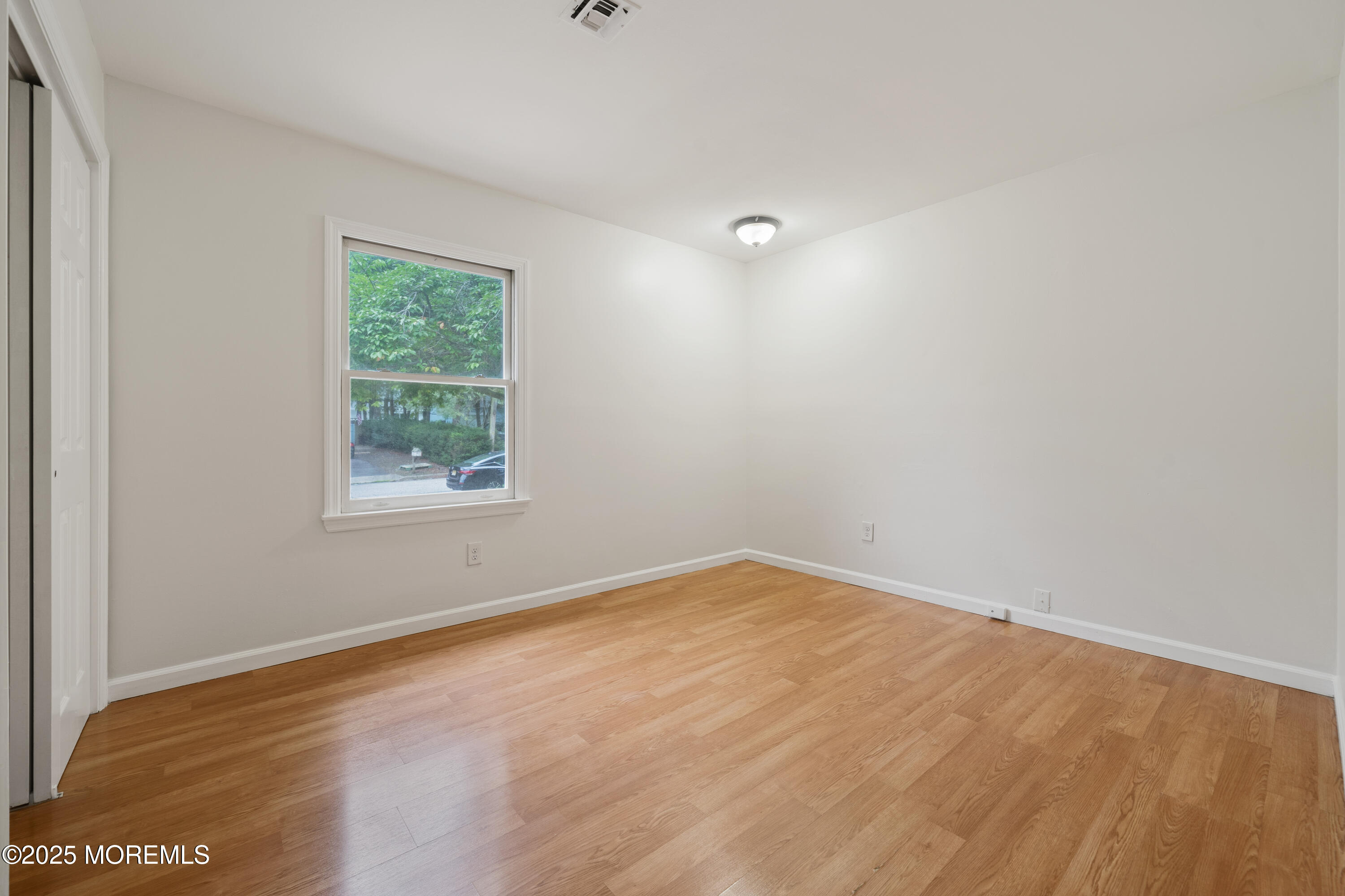 168 Stowaway Road Manahawkin, NJ 08050 - Photo 11 of 15 an empty room with a window