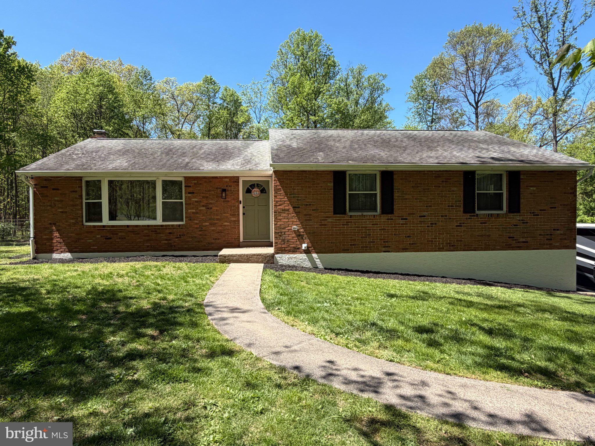 1199 Shenkel Road Pottstown, PA 19465 - Photo 1 of 38 Charming brick home in serene setting.