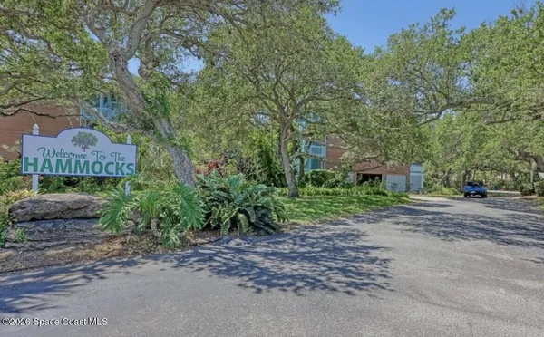 front view of a house with a garden