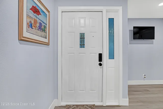 a view of a hallway with paintings on the wall