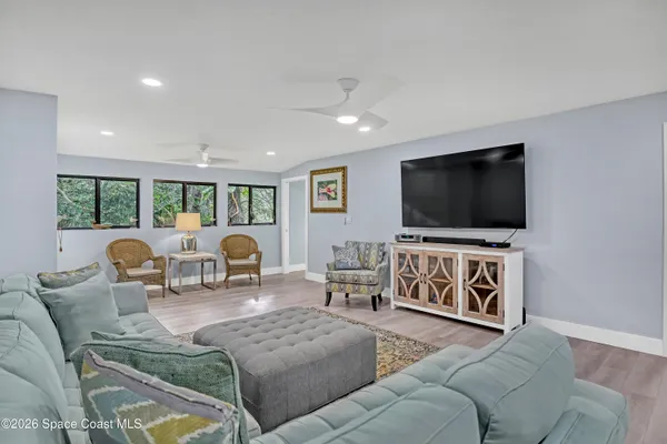 a living room with furniture and a window