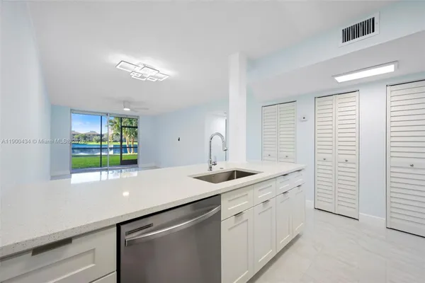 a view of kitchen with wooden floor