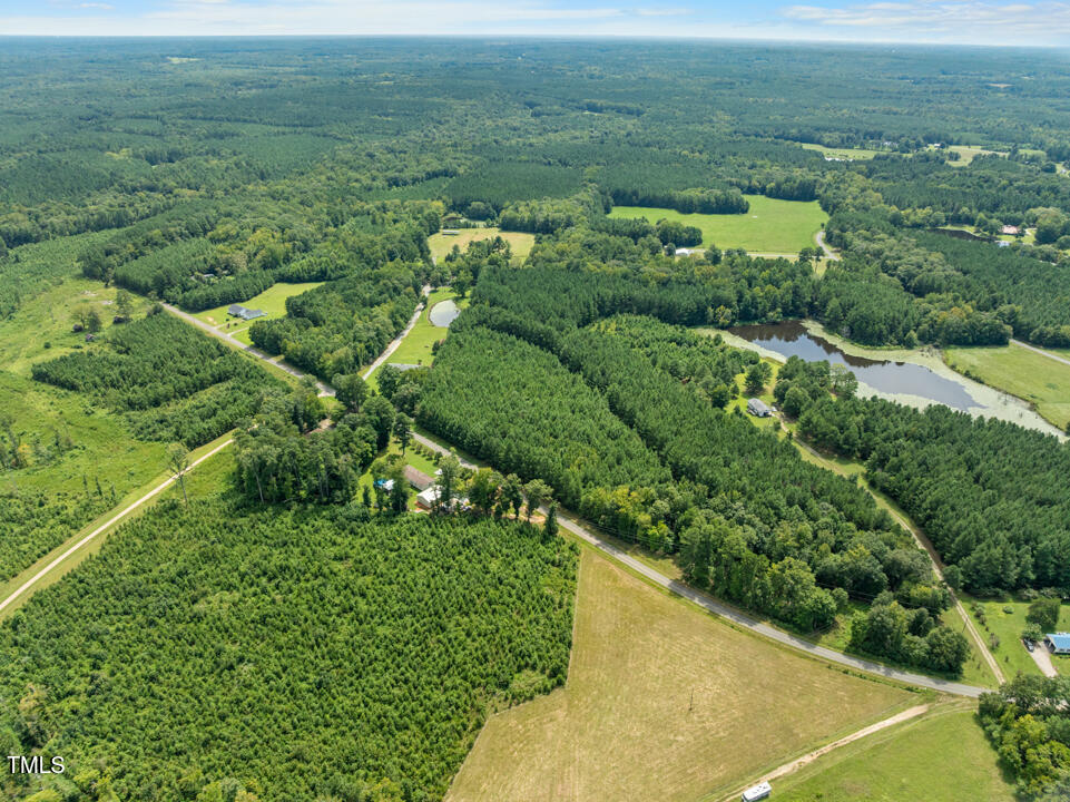 4104 Wilson Town Road Oxford, NC 27565 - Photo 2 of 7 a view of a field with an ocean