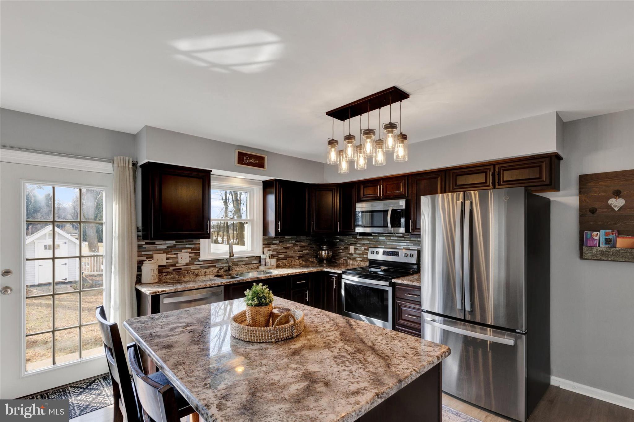 408 West 6th Street Lititz, PA 17543 - Photo 7 of 29 a kitchen with a refrigerator and a dining table