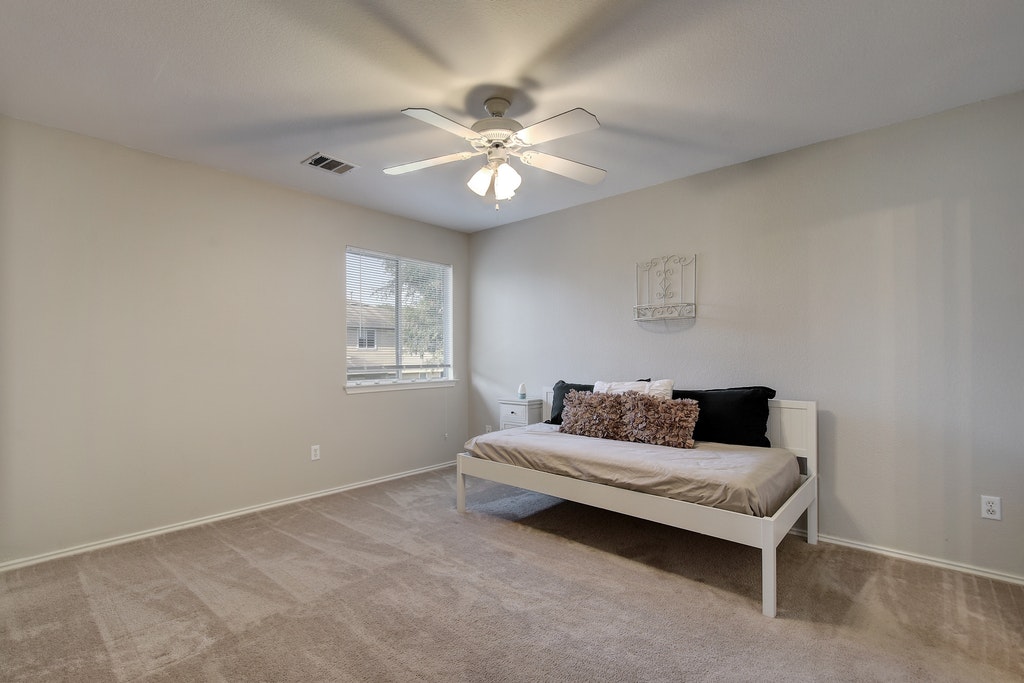2201 Keepsake Drive Austin, TX 78745 - Photo 16 of 25 a living room with furniture and a ceiling fan