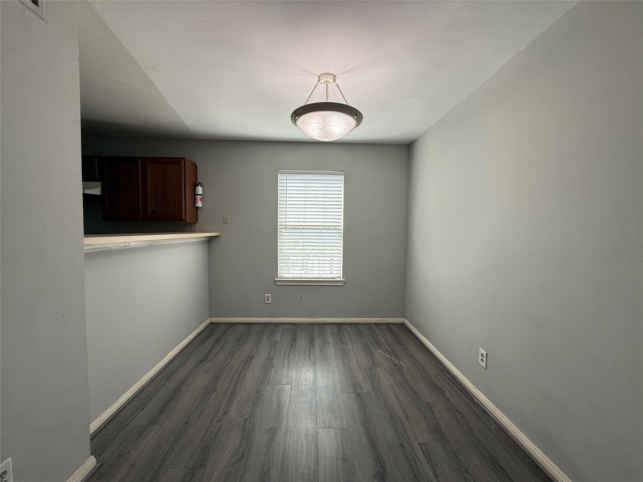 304 Dell Court, Unit 6 Houston, TX 77009 - Photo 4 of 14 an empty room with a hardwood and a window