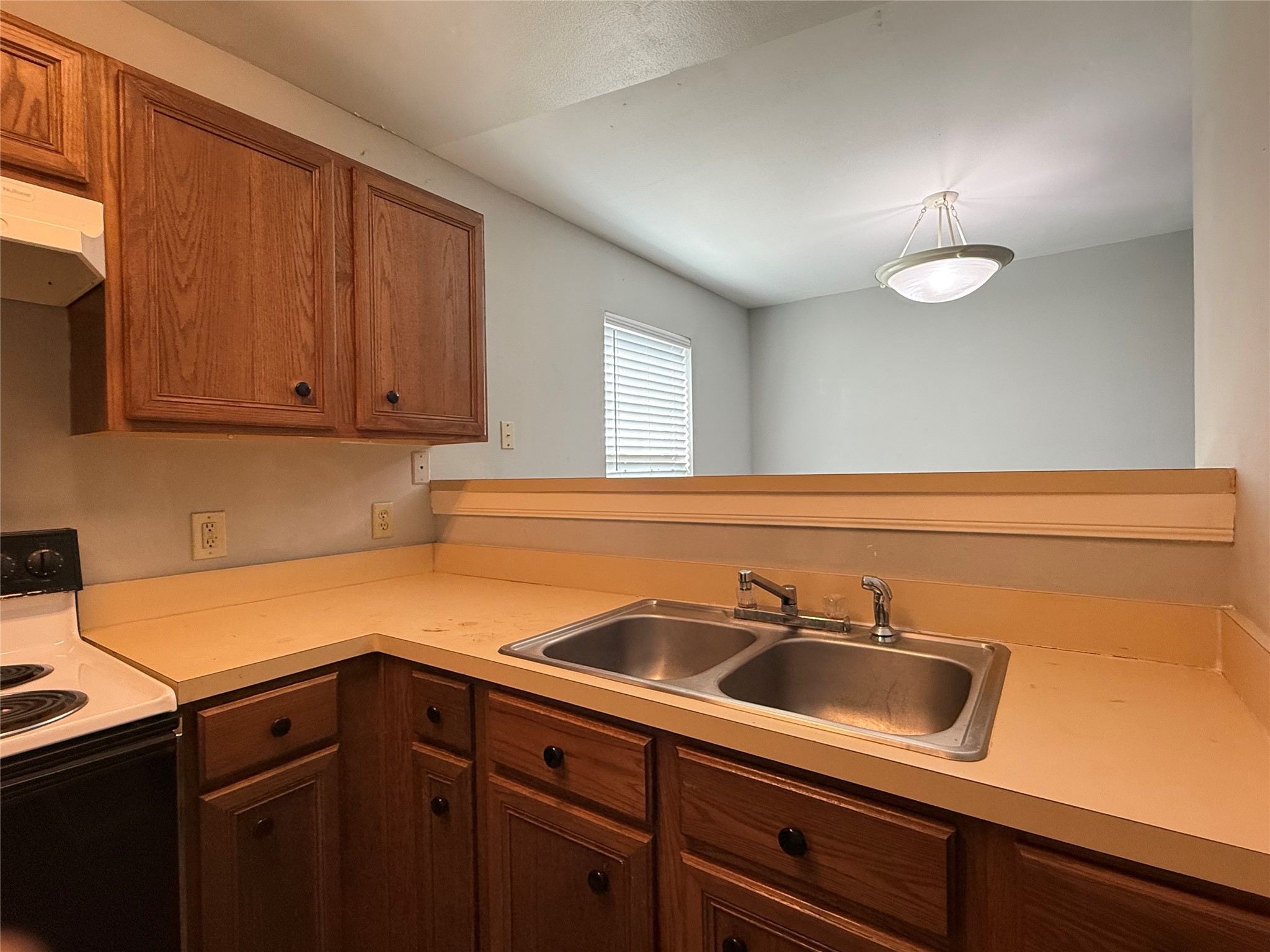 304 Dell Court, Unit 6 Houston, TX 77009 - Photo 8 of 14 a kitchen with a sink cabinets and stainless steel appliances