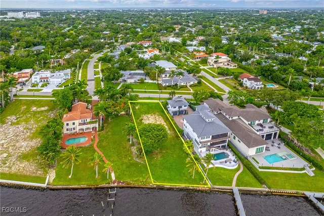 a green field with lots of tress in it