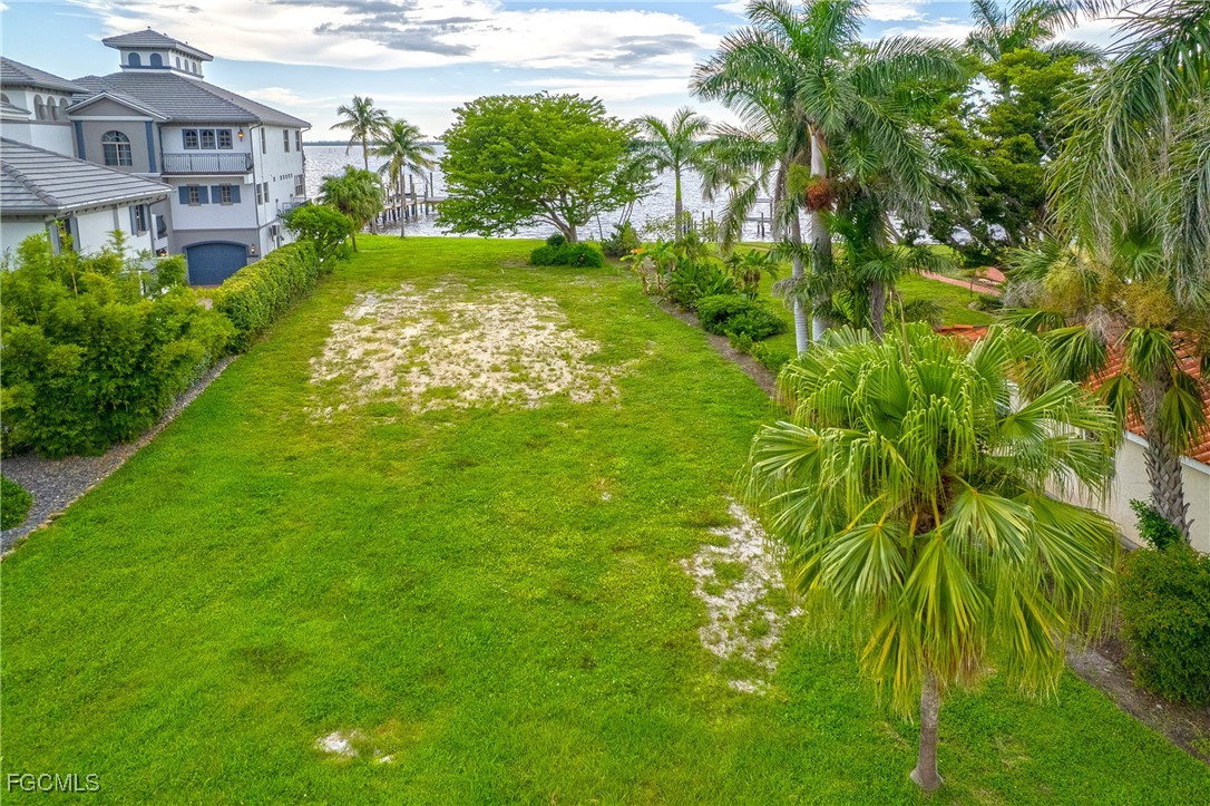 2904 Valencia Way Fort Myers, FL 33901 - Photo 8 of 14 a view of a garden with a building in the background