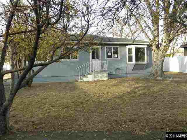 825 Bell Street Reno, NV 89503 - Photo 12 of 13 a view of a yard in front of a house with large tree