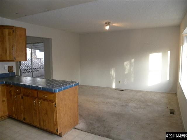 825 Bell Street Reno, NV 89503 - Photo 4 of 13 a kitchen with cabinets and window