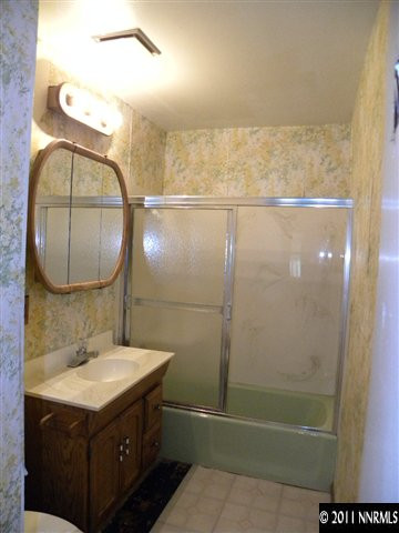 825 Bell Street Reno, NV 89503 - Photo 7 of 13 a bathroom with a sink mirror vanity and toilet